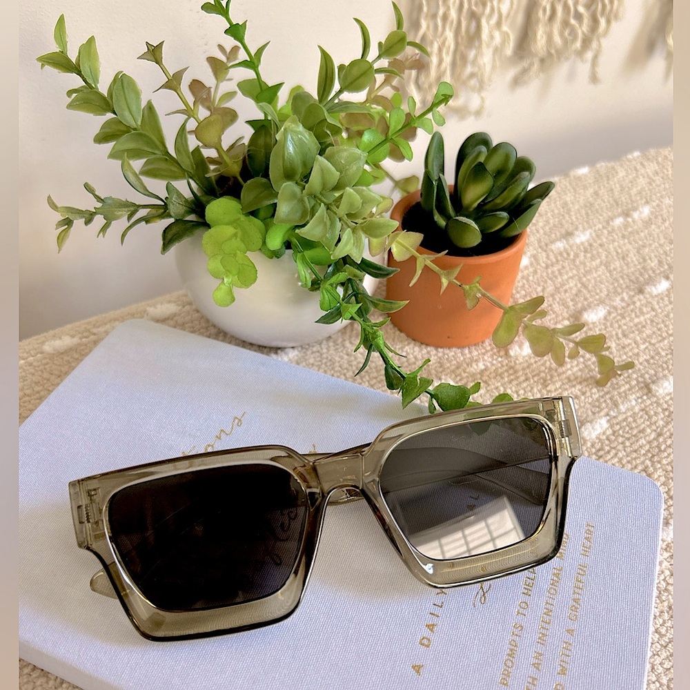 Greyish, greenish chunky sunglasses